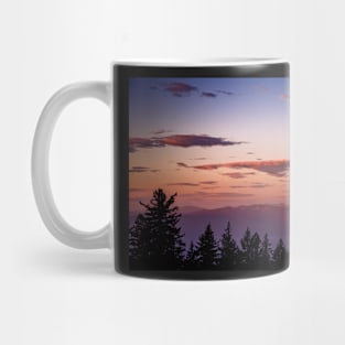 Clouds over mountains at sunset Mug